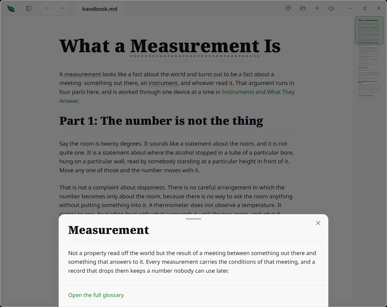 A glossary term underlined in a paragraph, with its entry open in a bottom sheet sliding up over the page, the document still visible behind it